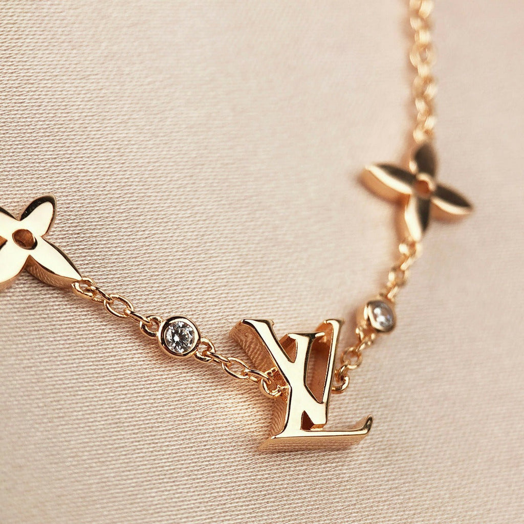 TimiSTAR AND SUN 7 MOTIFS GOLD BRACELET