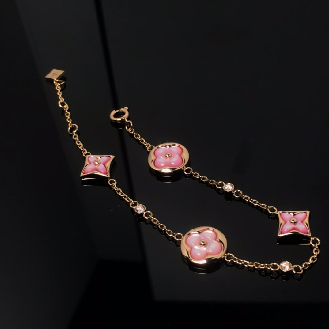 TimiSTAR AND SUN 4 MOTIF PINK MOP PINK GOLD BRACELET